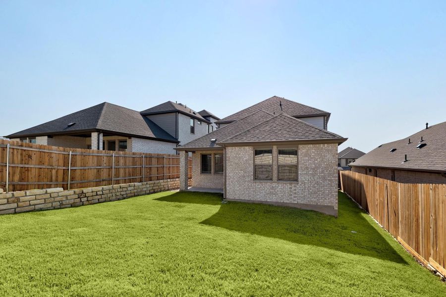 Exterior details and patio area of a home in Lakeside at Tessera, Lago Vista (Image 21).