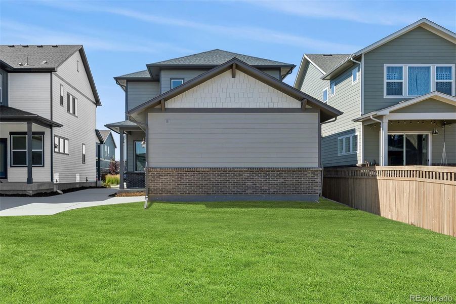 Front exterior of a new home in Painted Prairie Cottage, Aurora, CO, highlighting curb appeal (Image 23).