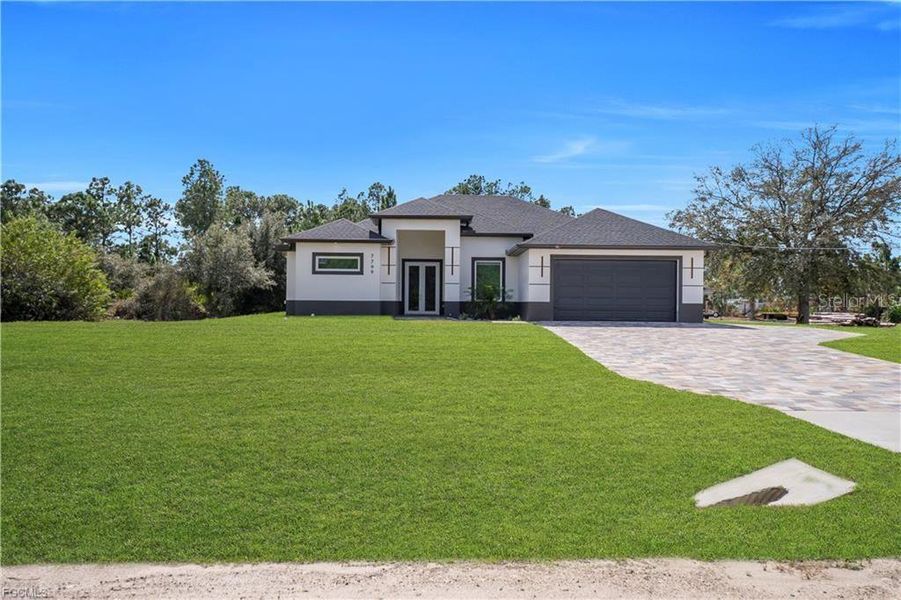 Front exterior of a new home in , Labelle, FL, highlighting curb appeal (Image 18). Front exterior of a new home in , Labelle, FL, highlighting curb appeal (Image 18).