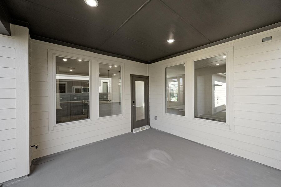 Exterior details and patio area of a home in The Retreat at Harvest, Argyle (Image 3).