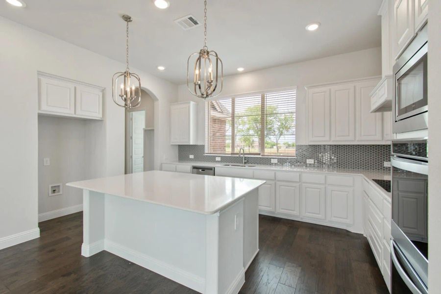 Kitchen | Concept 2797 at Hidden Creek Estates in Van Alstyne, TX by Landsea Homes