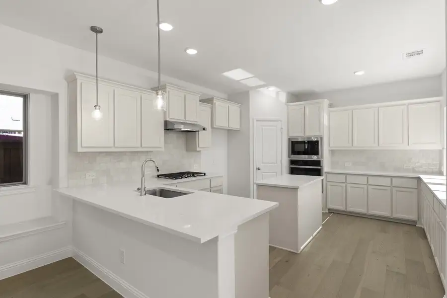 Representative furnished interior of a home built from the Trentino by Pacesetter Homes in Keeneland, Aubrey (Image 5).