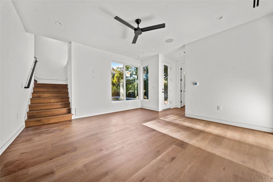 Lower level living room, bedroom 5 and full bath with direct access to the pool.