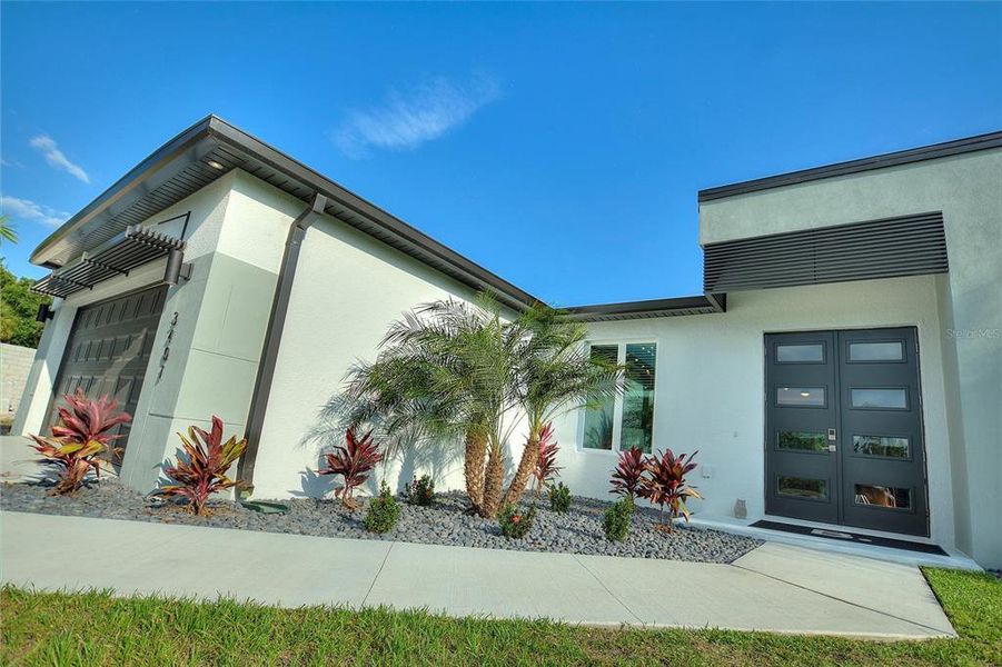 Front exterior of a new home in , Punta Gorda, FL, highlighting curb appeal (Image 22).