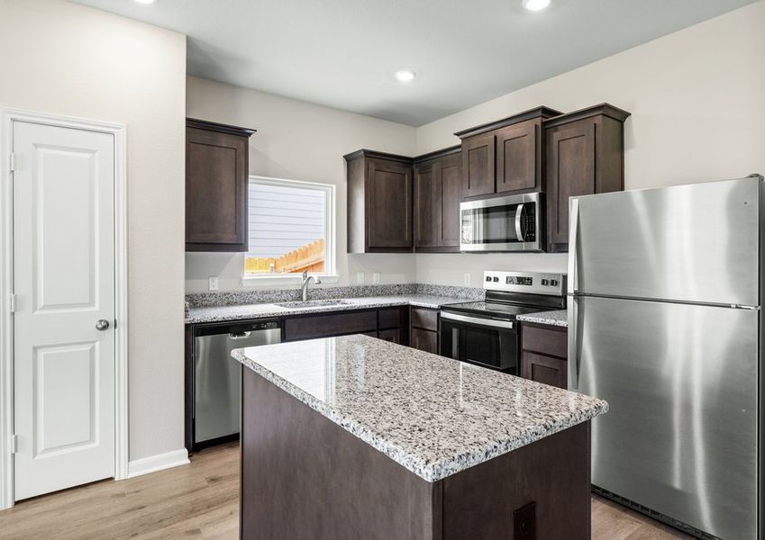 The kitchen has sprawling granite countertops. The kitchen has sprawling granite countertops.