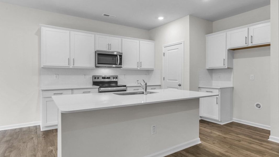 Representative furnished interior of a home built from the BOOTH by D.R. Horton in North Gate, Vass (Image 6).