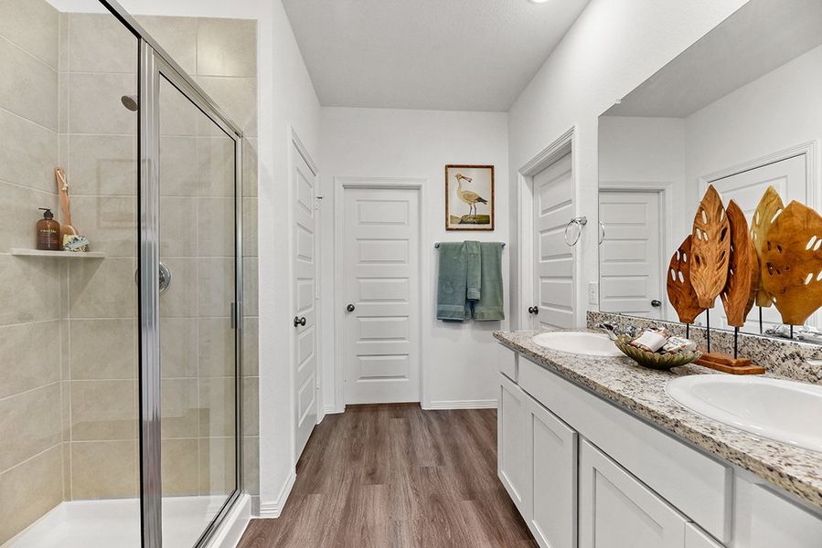 A bathroom with a glass shower. A bathroom with a glass shower.