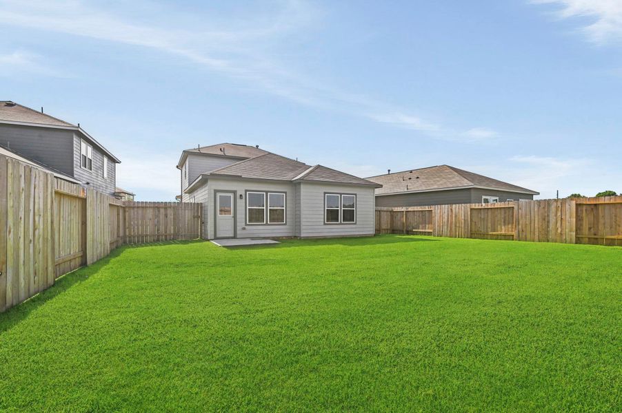 Exterior details and patio area of a home in Barrett Crossing, Crosby (Image 20).