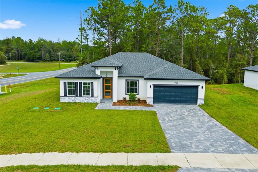 Front exterior of a new home in , Ocala, FL, highlighting curb appeal (Image 18).