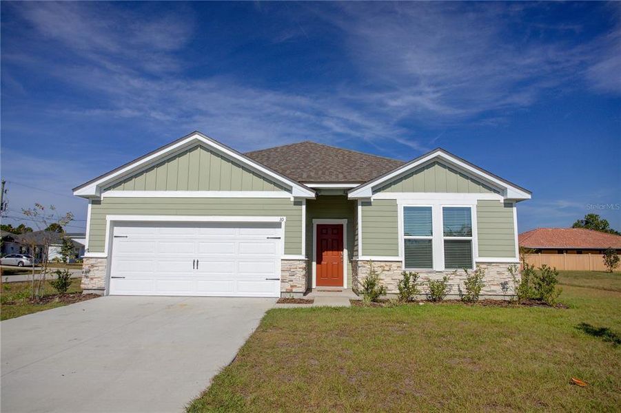 Front exterior of a new home in , Palm Coast, FL, highlighting curb appeal (Image 28).