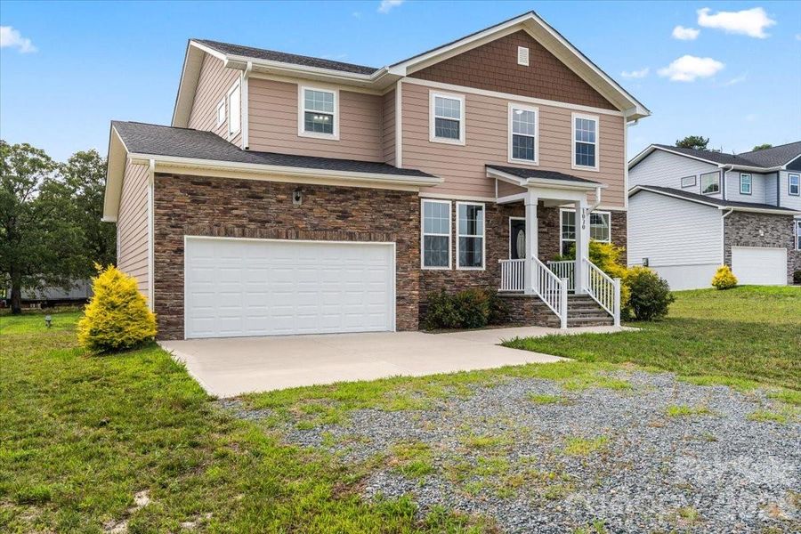 Front exterior of a new home in , Monroe, NC, highlighting curb appeal (Image 22).