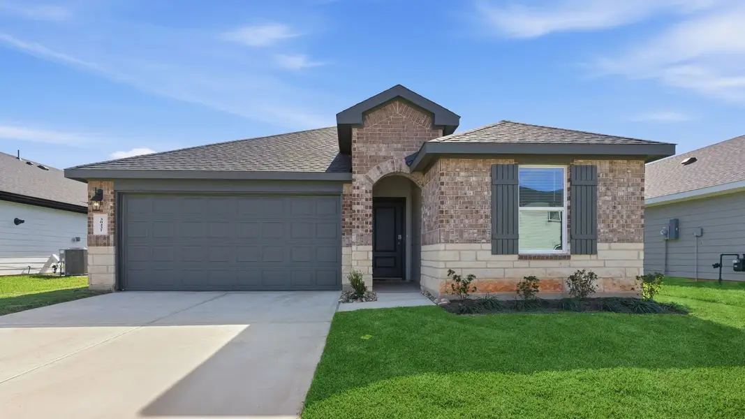 Front exterior of a new home in Tamarron, Fulshear, TX, highlighting curb appeal (Image 1). Front exterior of a new home in Tamarron, Fulshear, TX, highlighting curb appeal (Image 1).