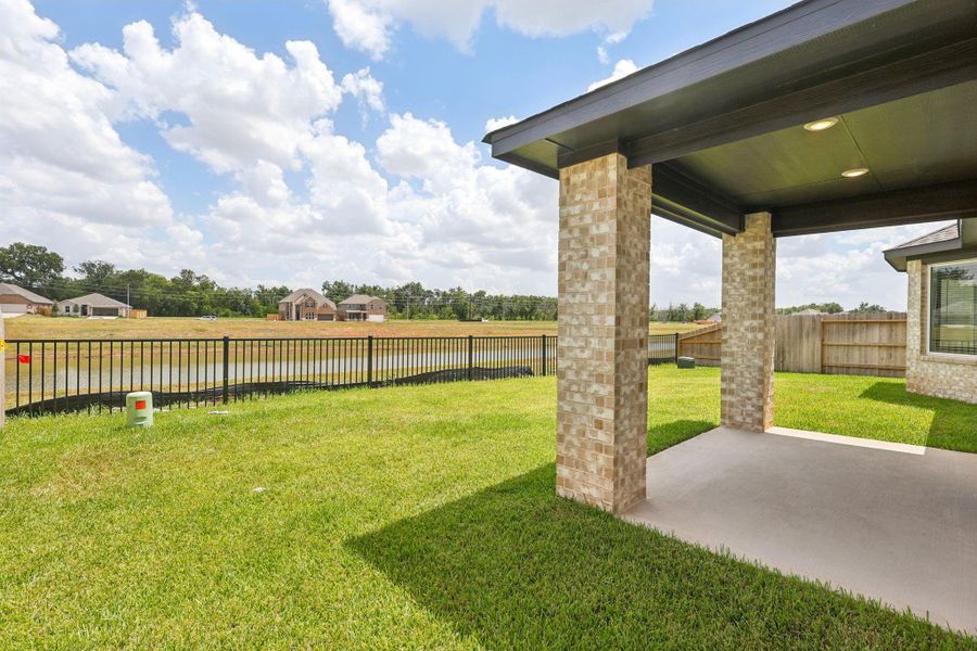Front exterior of a new home in Kingdom Heights, Rosenberg, TX, highlighting curb appeal (Image 25). Front exterior of a new home in Kingdom Heights, Rosenberg, TX, highlighting curb appeal (Image 25).