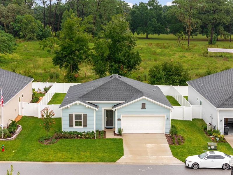 Front exterior of a new home in Liberty Village: Liberty Village - Phase Two, Ocala, FL, highlighting curb appeal (Image 2). Front exterior of a new home in Liberty Village: Liberty Village - Phase Two, Ocala, FL, highlighting curb appeal (Image 2).