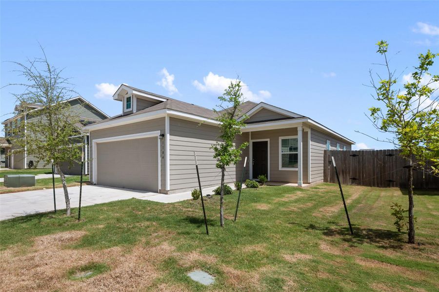 View of front of home featuring concrete driveway and a garage View of front of home featuring concrete driveway and a garage
