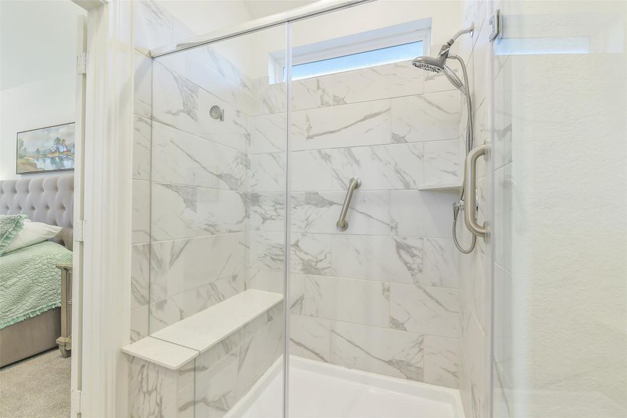 The super shower includes a coordinating quartz bench and upgraded shower head.