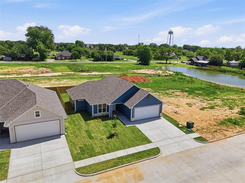 Front exterior of a new home in , Tolar, TX, highlighting curb appeal (Image 28).
