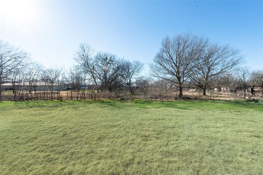 View of yard with a rural view