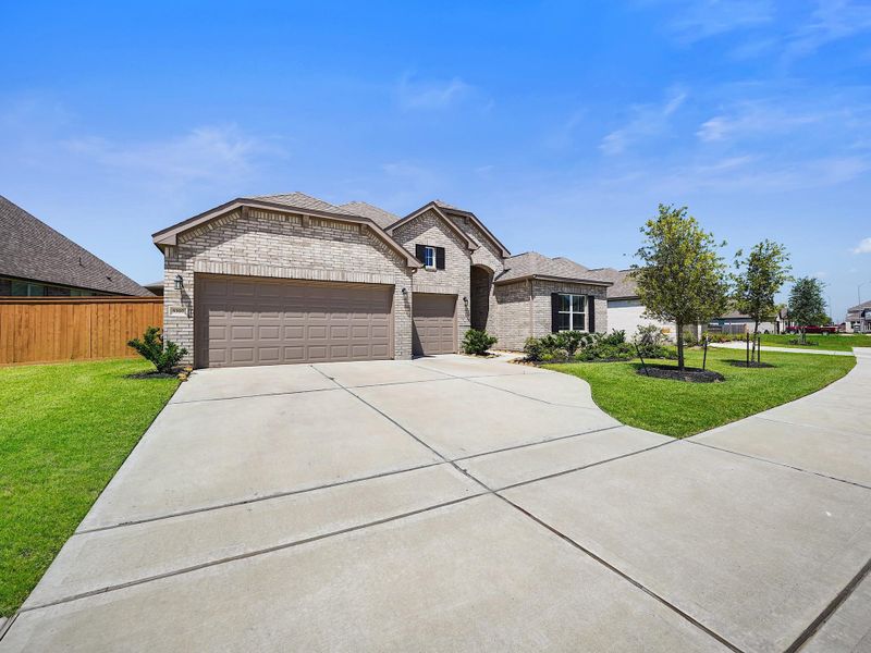 Front exterior of a new home in , Katy, TX, highlighting curb appeal (Image 22). Front exterior of a new home in , Katy, TX, highlighting curb appeal (Image 22).