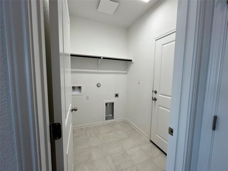Laundry room off garage entry. For demonstration purposes only. Same floorplan as 5331 Bruno.