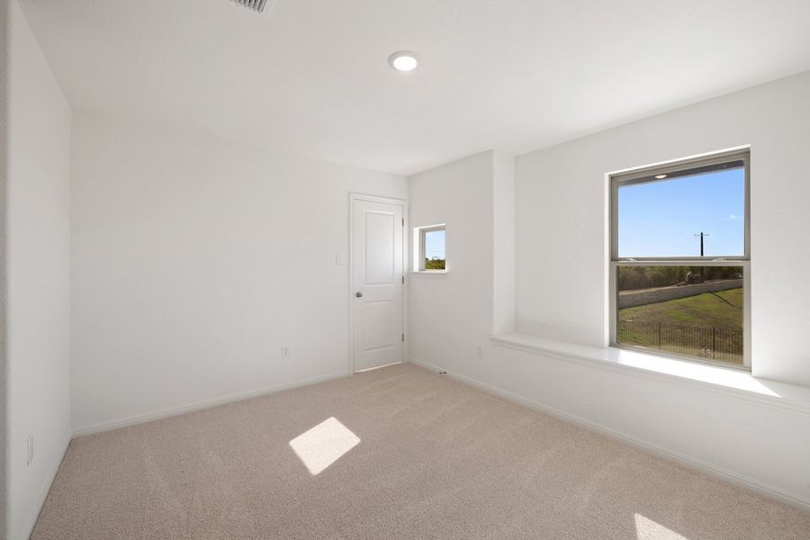 Spacious, unfurnished interior of a new home in The Hills of Bear Creek, Manchaca (Image 8).