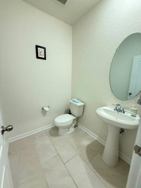Convenient first-floor powder bath perfectly located for guests and everyday use Convenient first-floor powder bath perfectly located for guests and everyday use