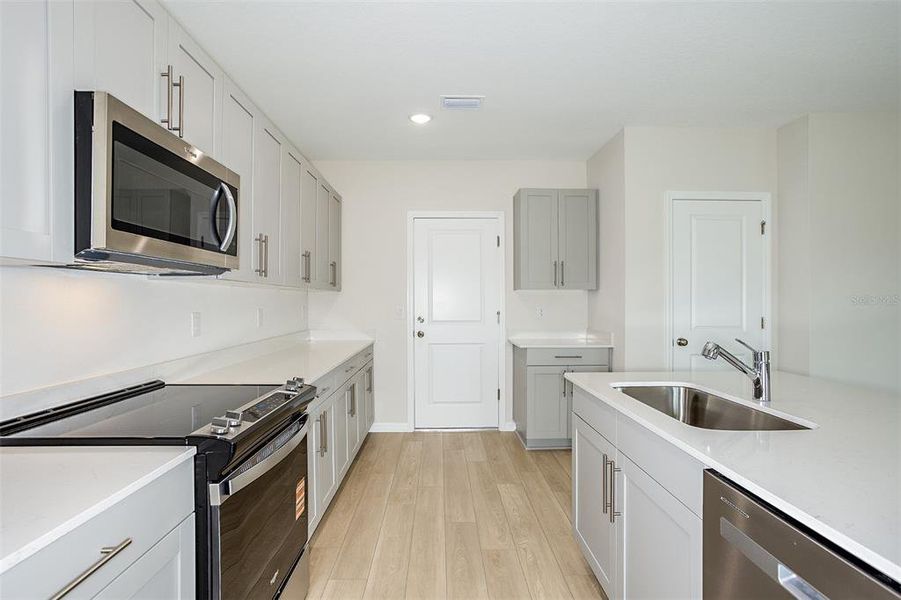Furnished interior view inside a new home in Pasadena Ridge, Dade City (Image 2).