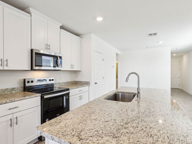 Furnished interior view inside a new home in Villamar - Classic Series, Winter Haven (Image 6). Furnished interior view inside a new home in Villamar - Classic Series, Winter Haven (Image 6).