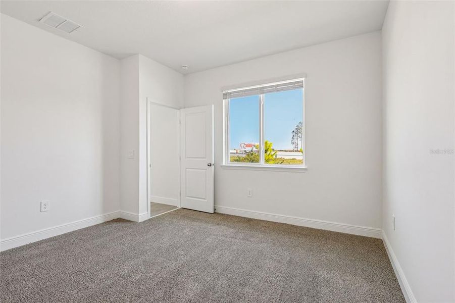 Spacious, unfurnished interior of a new home in Cyrene at Minneola - Villas, Minneola (Image 26).