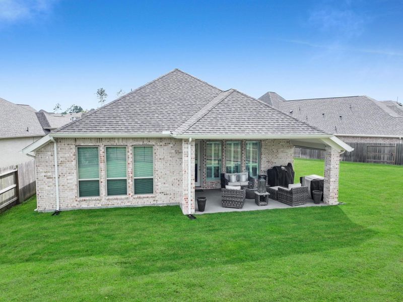 Exterior details and patio area of a home in Artavia, Conroe (Image 3).
