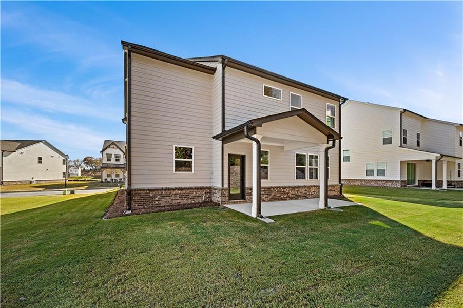 Exterior details and patio area of a home in The Paddocks at Doc Hughes, Buford (Image 3).