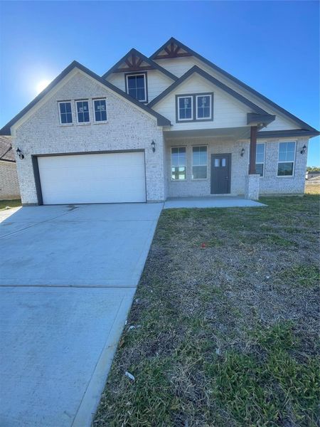 Front exterior of a new home in , Anahuac, TX, highlighting curb appeal (Image 1).