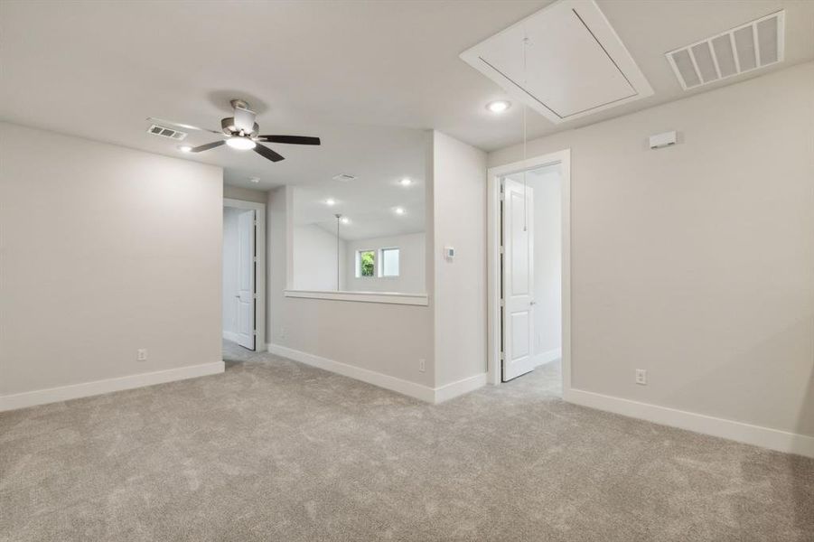 Unfurnished  gameroom with light carpet, and baseboards