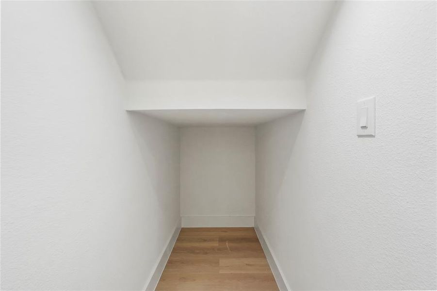 Detailed view of wood finished floors and baseboards