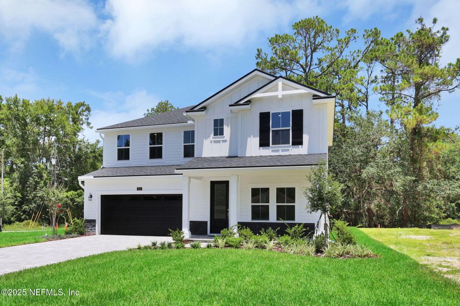 Front exterior of a new home in Creighton Pointe, Fleming Island, FL, highlighting curb appeal (Image 23).