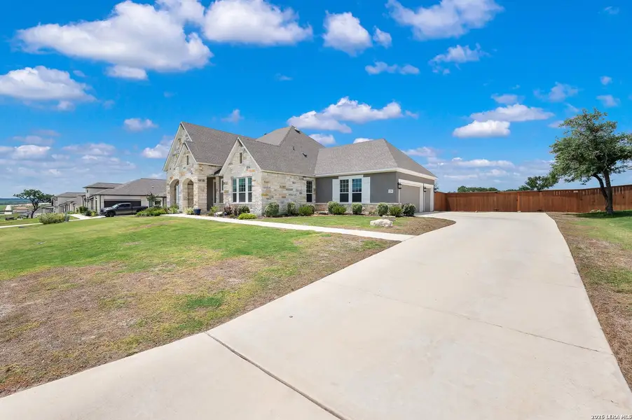 Front exterior of a new home in , Castroville, TX, highlighting curb appeal (Image 2). Front exterior of a new home in , Castroville, TX, highlighting curb appeal (Image 2).