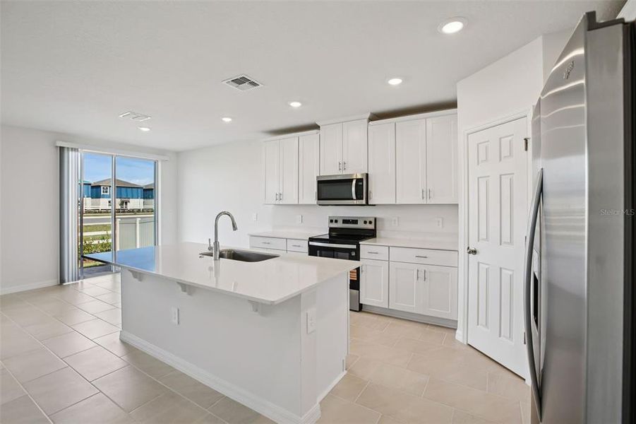 Furnished interior view inside a new home in Villamar - Signature Series, Winter Haven (Image 9).