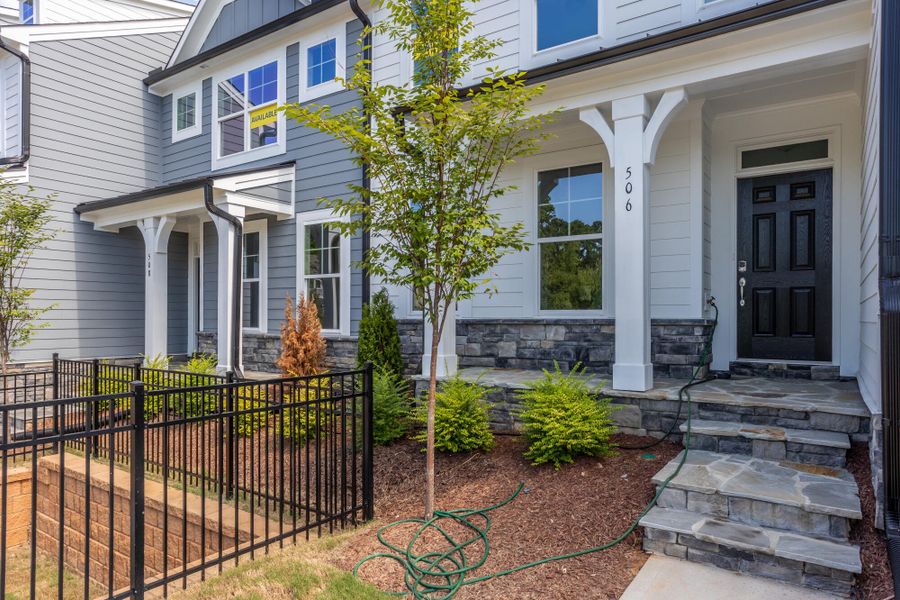Exterior details and patio area of a home in Enclave at Traditions Townhomes, Wake Forest (Image 3).