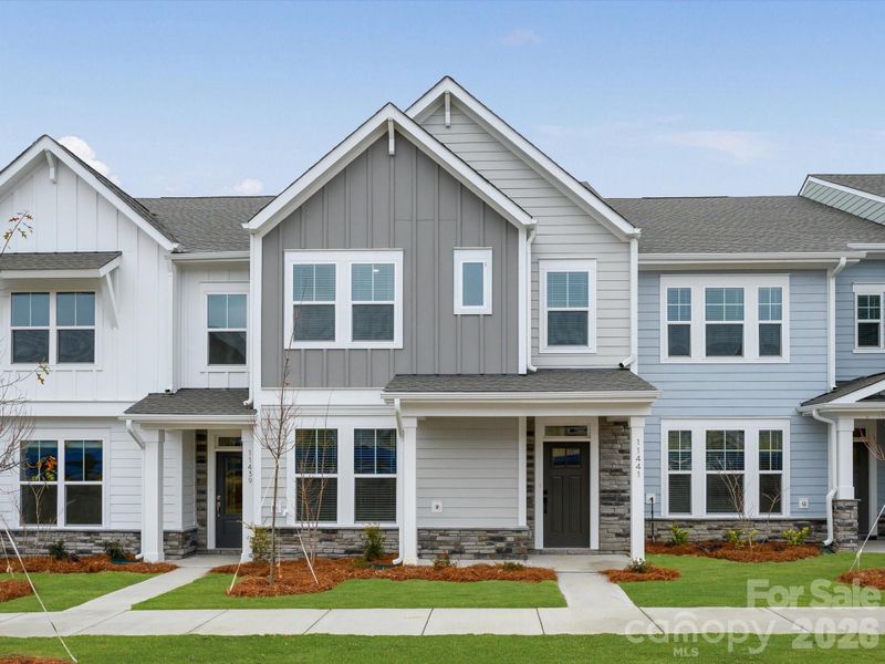 Front exterior of a new home in North Creek Village, Huntersville, NC, highlighting curb appeal (Image 18).