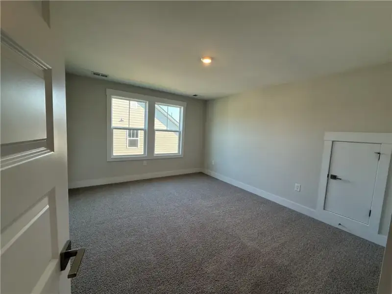Warm plush carpeting and double windows define thi