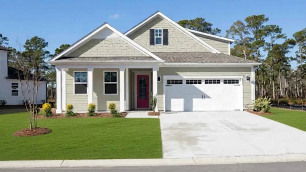 Front exterior of a new home in The Haven at Indigo Preserve, Leland, NC, highlighting curb appeal (Image 1). Front exterior of a new home in The Haven at Indigo Preserve, Leland, NC, highlighting curb appeal (Image 1).