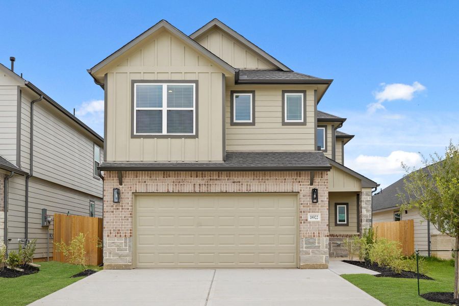 Front exterior of a new home in Grand Oaks Village, Houston, TX, highlighting curb appeal (Image 2). Front exterior of a new home in Grand Oaks Village, Houston, TX, highlighting curb appeal (Image 2).