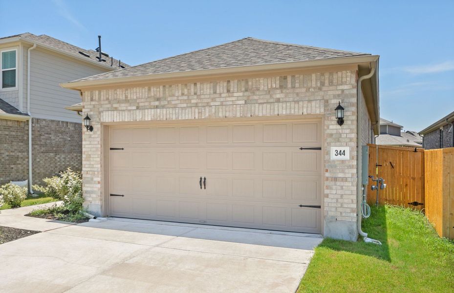 Front exterior of a new home in Crosswinds, Kyle, TX, highlighting curb appeal (Image 18). Front exterior of a new home in Crosswinds, Kyle, TX, highlighting curb appeal (Image 18).