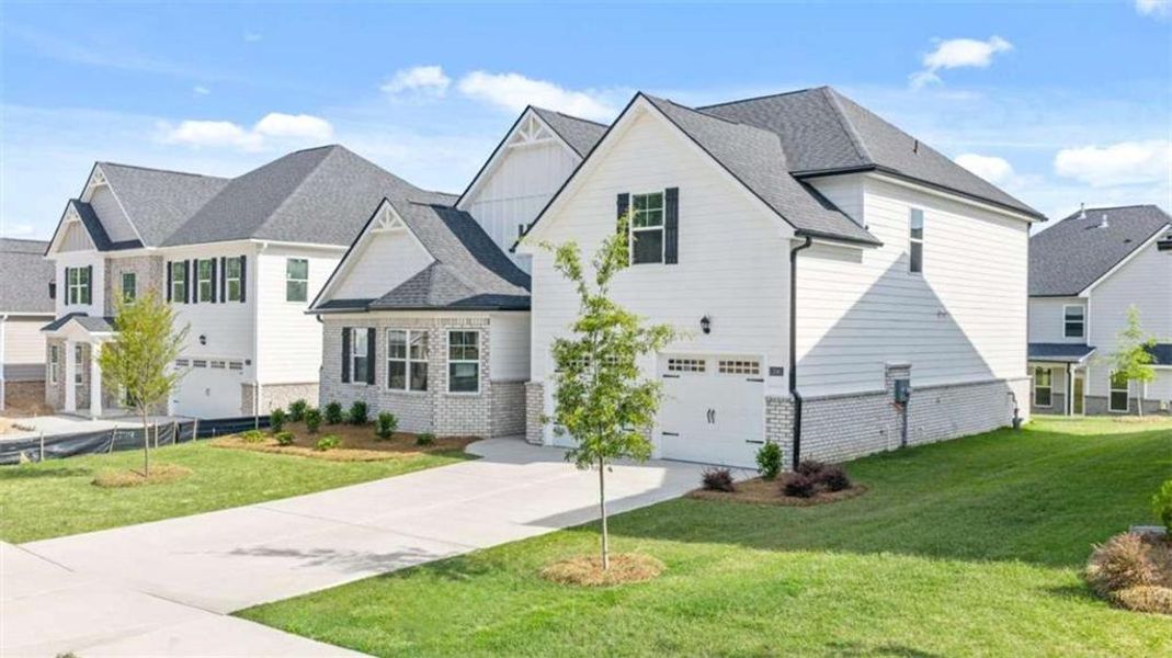 Front exterior of a new home in Wildwood, Covington, GA, highlighting curb appeal (Image 2).