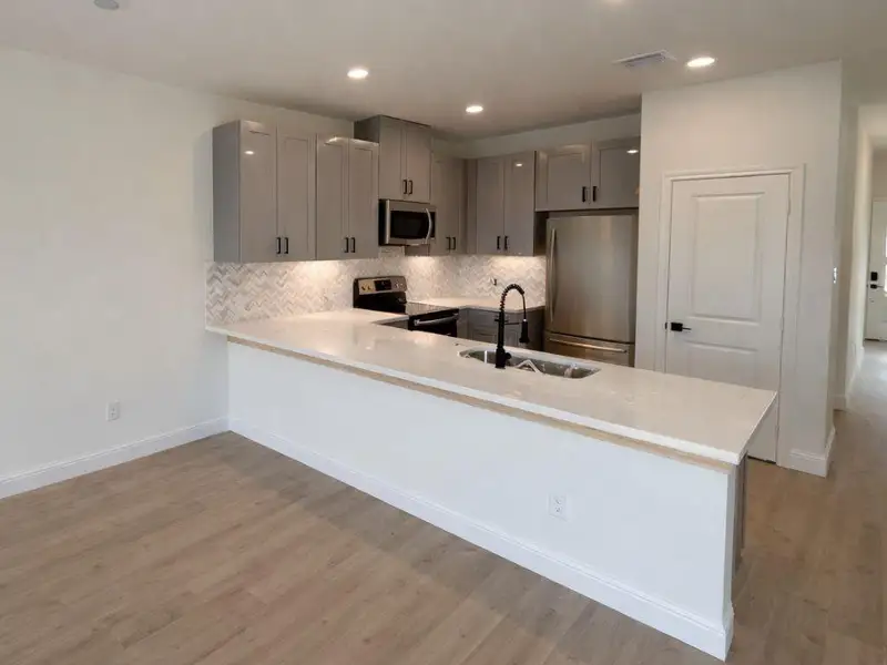 Furnished interior view inside a new home in Hill & Dale Ranch, Splendora (Image 3).