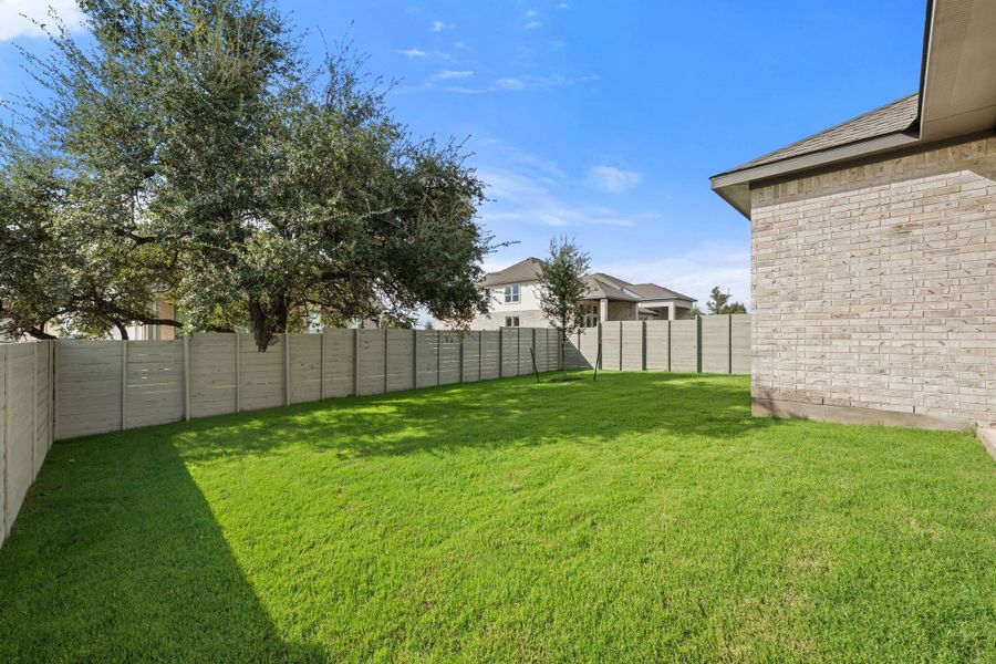 Exterior details and patio area of a home in Wolf Ranch, Georgetown (Image 29).