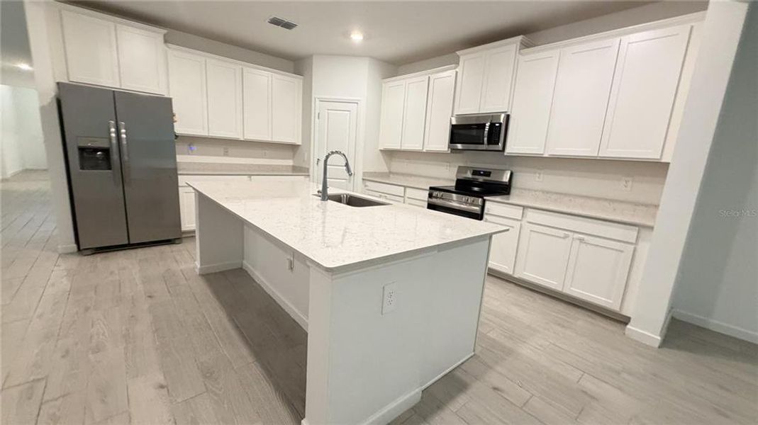 Furnished interior view inside a new home in Grand Park North, Dunnellon (Image 6).