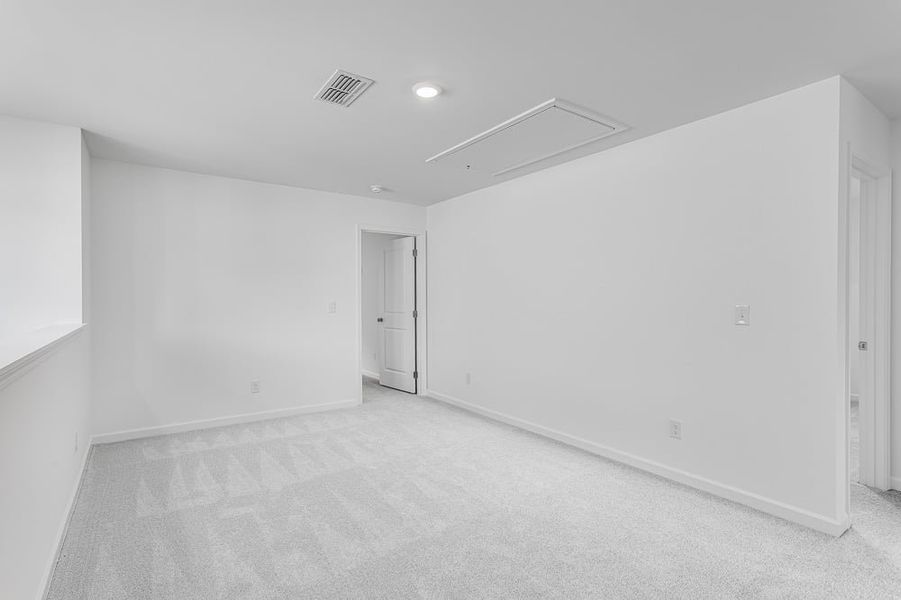 Representative unfurnished interior of a home built from the Avera by Taylor Morrison in Falls Creek, Flowery Branch (Image 26).