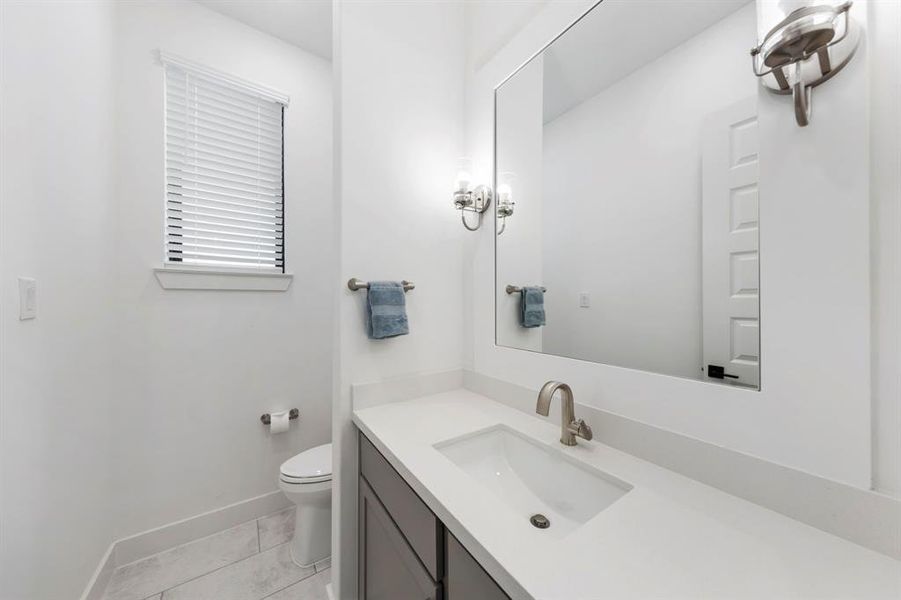 A stylish half bath is conveniently located on the main floor.