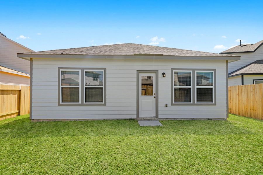 Exterior details and patio area of a home in Lonestar Collection at Granger Pines, Conroe (Image 4).